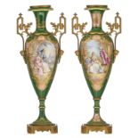A pair of Sèvres type vases, green ground and the roundels polychrome decorated with a hand painted