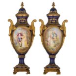 A fine pair of covered bleu royale ground Sèvres vases with gilt bronze mounts, the roundels polychr
