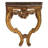 A richly sculpted Rococo gilt console with a Rouge Royal marble top, 18thC, H 80 - W 66 - D 39 cm