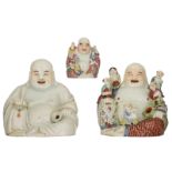 Three Chinese polychrome decorated Budai, two figures holding a chain of praying beads, two figures