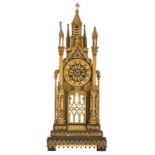 A Gothic Revival gilt bronze pendulum clock, shaped like a Gothic cathedral, the second half of the