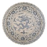 A large Chinese blue and white charger with lobed edge, decorated with flowers and a dragon, H 8 - ø