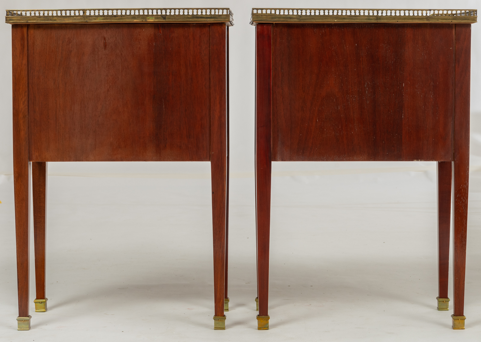 A pair of Neoclassical mahogany veneered side tables, with brass mounts and a gris Ste Anne marble t - Image 4 of 8