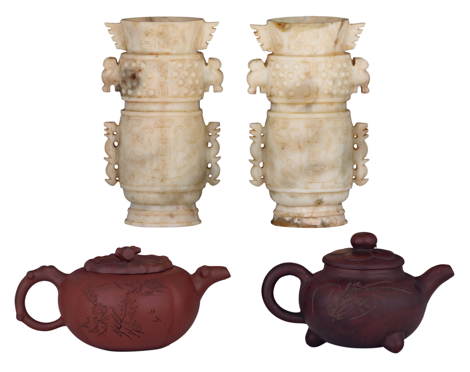 Two Chinese Yixing teapots and covers with calligraphic texts, marked; added two Chinese carved ston