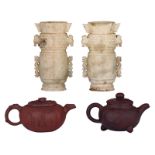Two Chinese Yixing teapots and covers with calligraphic texts, marked; added two Chinese carved ston