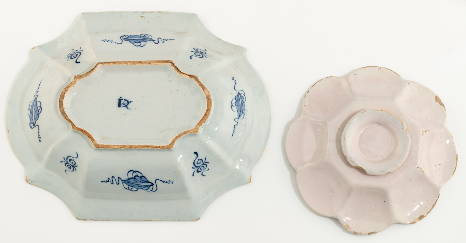 A blue and white decorated Dutch Delftware charger, depicting a gallant scene of a man picking an ap - Image 2 of 3