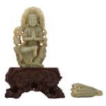 An Oriental jade carved meditating figure in tree pose, on a matching hardwood carved base; added a