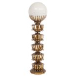 A mid-century vintage floor lamp, a gilt brass floral decorated stand with a balloon-shaped glass to