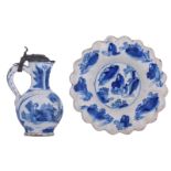A blue and white decorated Dutch Delftware chinoiserie jug with a pewter lid, marked, H 17 cm; added