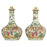 Two Chinese Canton bottle vases, famille rose decorated with flowers and auspicious symbols, the rou