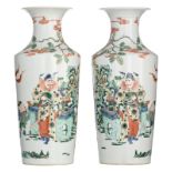 A pair of Chinese famille verte vases, decorated with an animated scene, 19thC, H 43,5