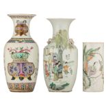 Two Chinese famille rose vases, decorated with flower baskets and ladies and children in a garden se