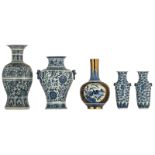 A Chinese blue and white floral decorated baluster-shaped vase and a ditto vase, the handles Fu lion