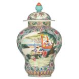 A Chinese famille rose floral decorated vase and cover, the roundels with flowers and animated scene
