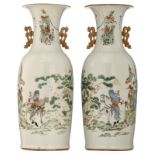 A pair of Chinese polychrome vases, all-over decorated with flowers, texts and Immortals in a landsc