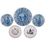 A blue and white Delftware charger with a scalloped rim, decorated with a crane and insects, marked