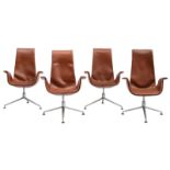 A set of four cognac leather upholstered 'Tulip chairs' with a swivel base, design by Fabricius & Ka