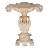 An imposing and finely carved alabaster 'pièce de milieu', floral decorated and the foot surrounded