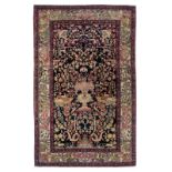 An Oriental silk and woollen Isfahan rug, the centre decorated with a flower basket surrounded by an
