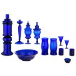 A various collection of cobalt blue glassware, consisting of a total of 13 classic and modern items,