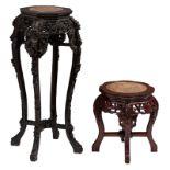 Two Chinese richly sculpted hardwood bases with a marble top, H 43 - 90,5 - ø 43 - 49 cm