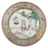 A large Chinese plate, decorated with a romantic garden scene, Yongzheng, H 5,5 - ø 38 cm