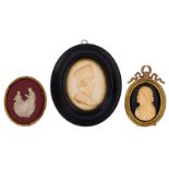 Two oval-shaped bas-relief sculpted ivory profile portrait miniatures, one in Renaissance style and