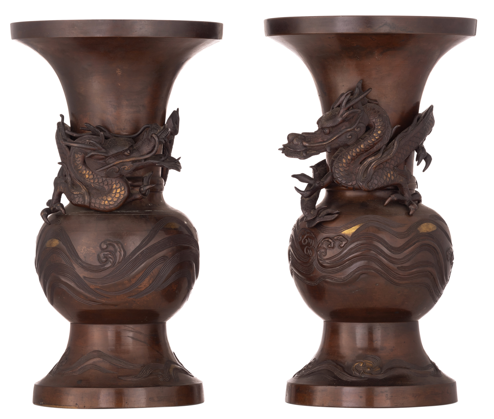 A pair of Oriental bronze vases, relief decorated with a dragon, turning around the neck, H 46 cm