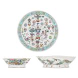 A Chinese famille rose dish and two ditto footed plates, decorated with auspicious symbols and birds