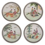A set of four Chinese famille rose dishes, decorated with ladies in a garden setting, the back with