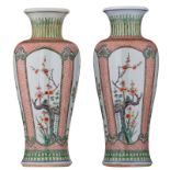 A pair of Chinese famille verte vases, the roundels decorated with flower branches representing the