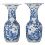 Two Japanese blue and white floral decorated vases, the roundels with birds, the top rim lotus-shape