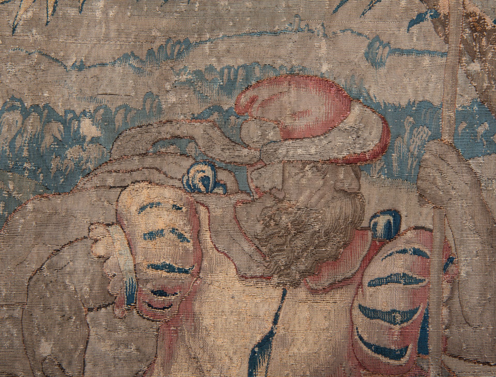 A fragment of a Flemish wall tapestry depicting fleeing figures, probably from a Brussels workshop, - Image 3 of 3