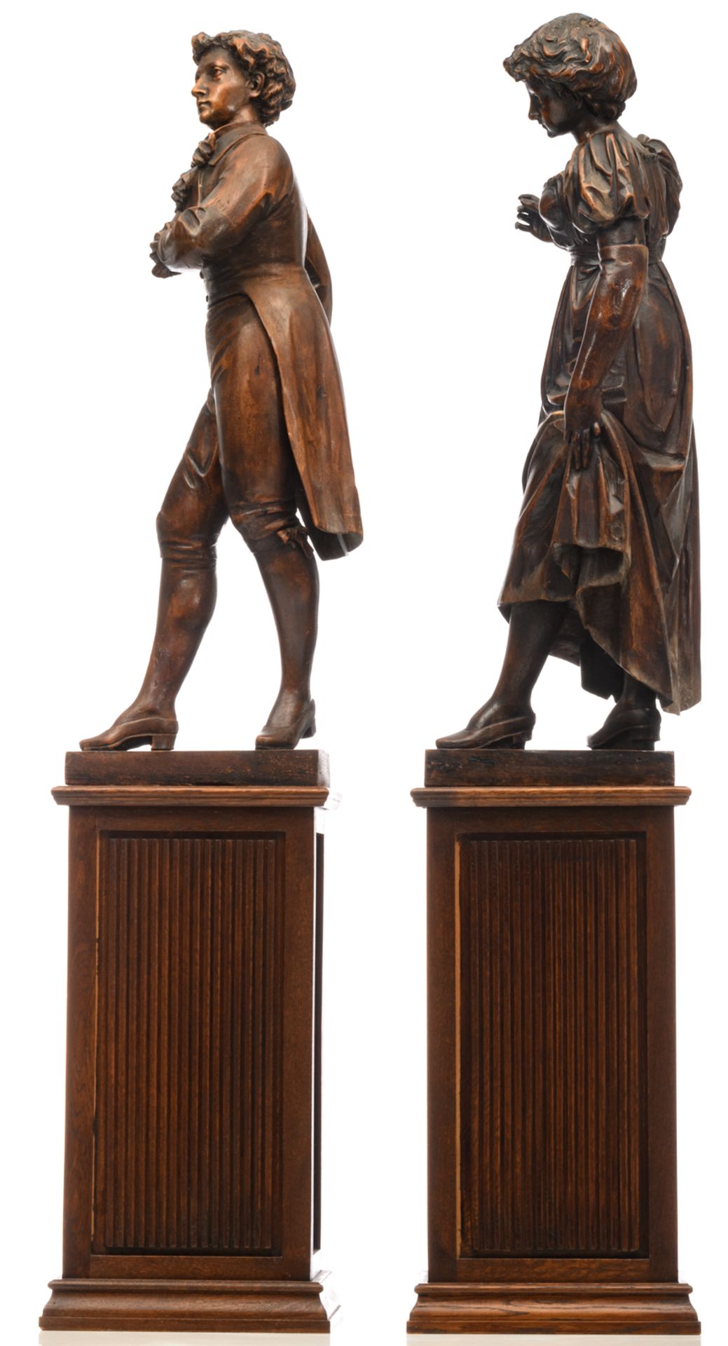 A gallant oak couple on a matching wooden base, early 20thC, H 87 - 147 cm (with base) - Image 2 of 4