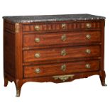A Louis XVI rosewood and rosewood parquetry veneered chest of drawers with brass mounts and a gris S