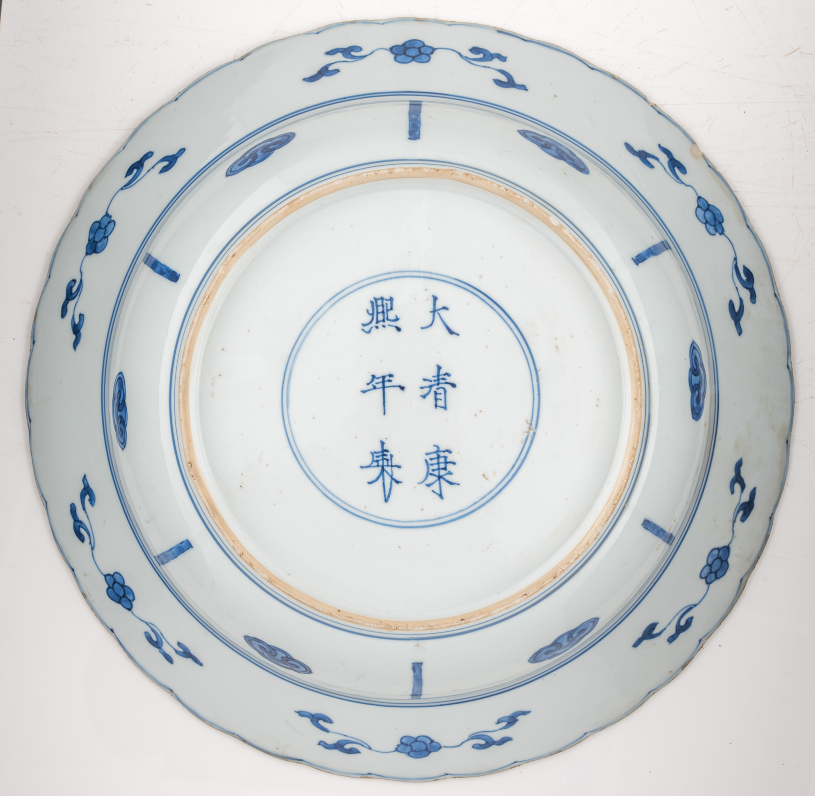 A large Chinese blue and white deep charger, decorated with beauties, birds and flowers, Kangxi mark - Image 2 of 2