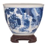 A Chinese transitional type blue and white jardiniere, decorated with figures, on a matching hardwoo