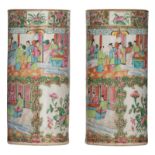 Two Chinese Canton cylindrical vases, decorated with birds and animated scenes, H 31 cm