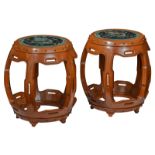 A pair of Chinese hardwood carved stools with famille verte and famille noire porcelain top, decorat