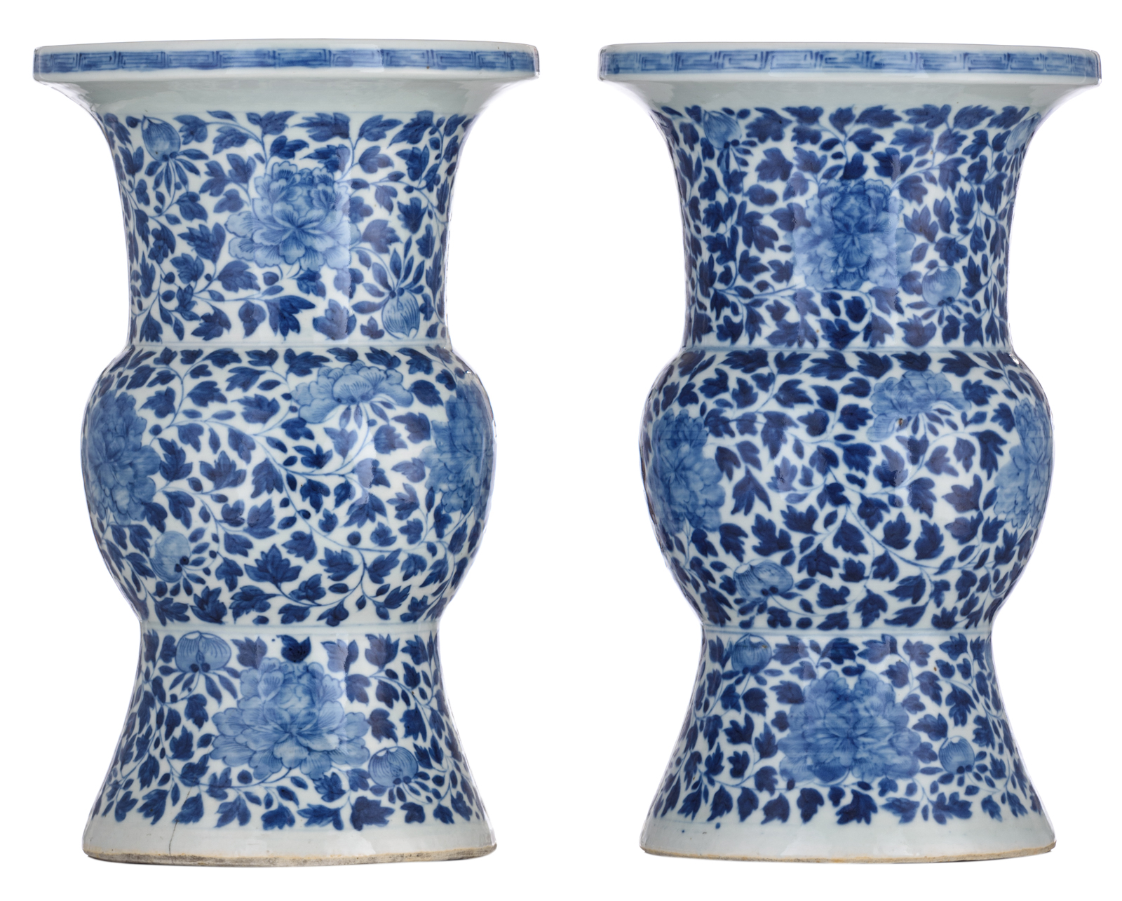 A pair of Chinese blue and white floral decorated Gu vases, 19thC, H 40,5 cm
