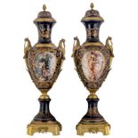 An imposing pair of bleu royale ground covered vases in the Sèvres manner, with gilt bronze mounts,