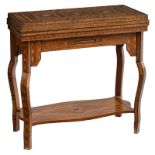 A Moorish inspired card table, inlaid with various wood types and mother of pearl, the folding top e