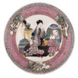 A Chinese ruby back and famille rose deep dish, decorated with a lady and children in an interior, Y