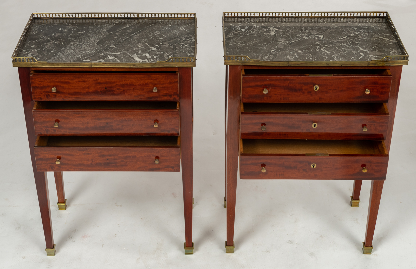 A pair of Neoclassical mahogany veneered side tables, with brass mounts and a gris Ste Anne marble t - Image 8 of 8