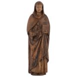 An oak standing figure of a founder of a monastic order,  with traces of bolus and polychrome paint,