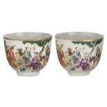 Two Chinese famille rose and gilt cups, decorated with Immortals, gathering in a garden, marked Daog