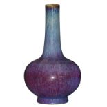 A Chinese purple flambé glazed bottle vase, marked, H 34 cm