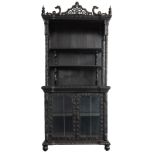 A Chinese ebonised hardwood display cabinet, richly decorated with flower branches and mounted with