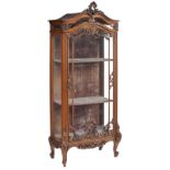A fine Rococo style richly sculpted walnut display cabinet, in the Namurois manner and quality, the