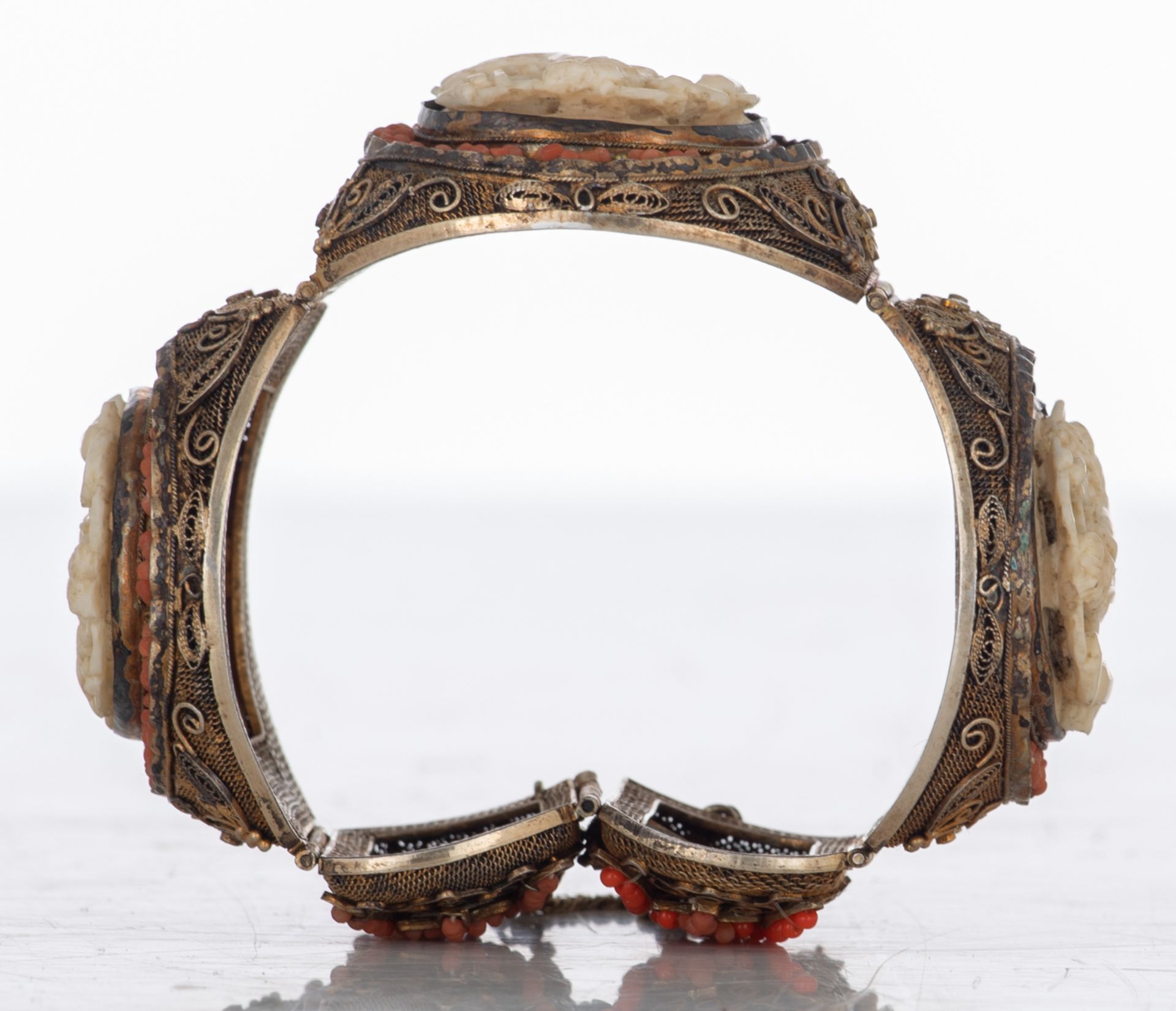An Oriental filigree gilt silver bracelet set with basso-relievo cut ivory plaques surrounded by cor - Image 6 of 8